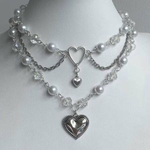 Faux pearl and heart pendant necklace and choker